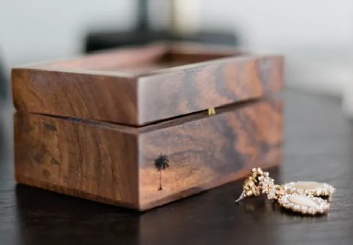 Dark wood gift box with glass lid.